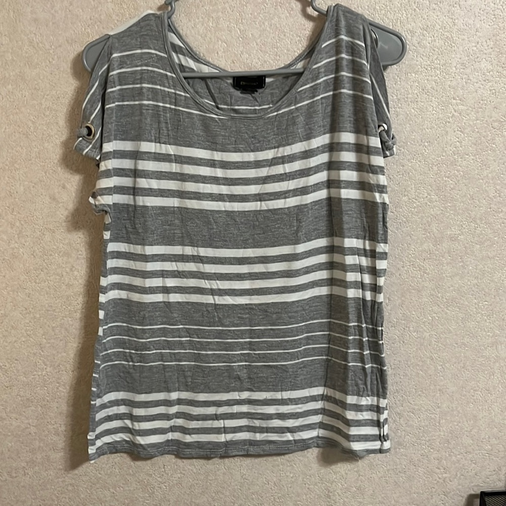 This is a grey/white striped tee with shoulder slits and short sleeves.